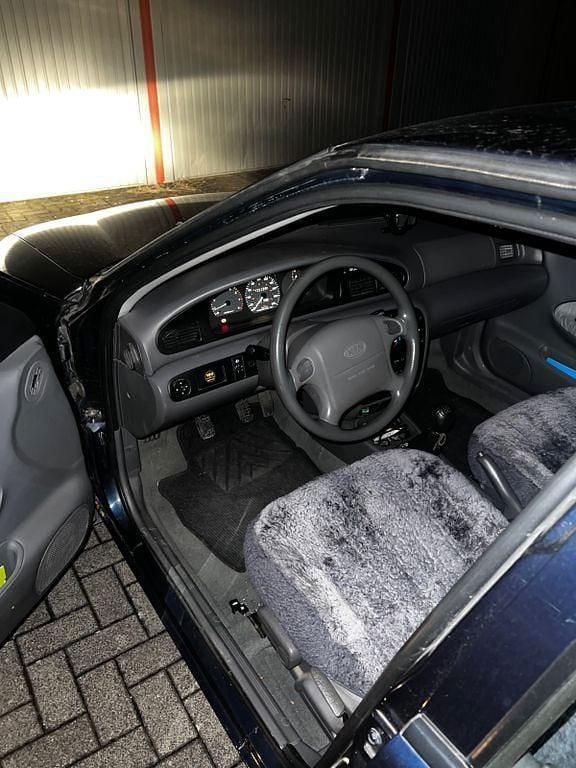 Second-hand Kia Sephia 80 CP (58 kW) 1996 Albastru Berlinǎ