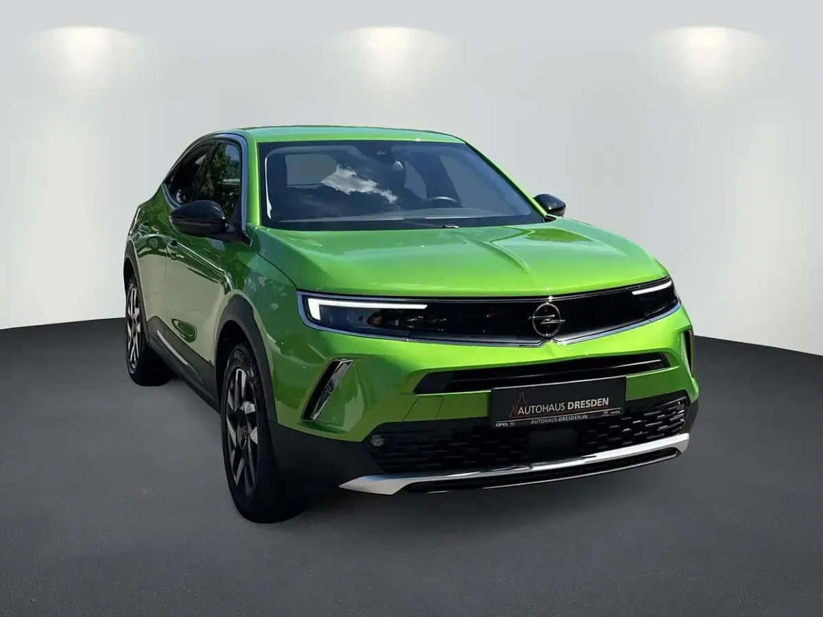 Gebraucht Opel Mokka-e Elegance 100 kW (136 PS) 2022 Matcha green (metallic) SUV