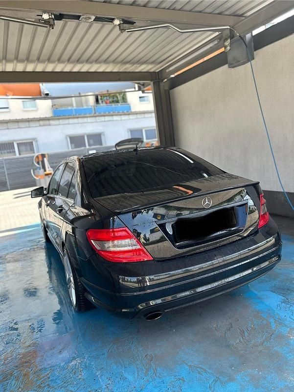 Schwarz Gebraucht 2009 Mercedes C180 AMG Limousine | 10.999 € - Bild 1/4