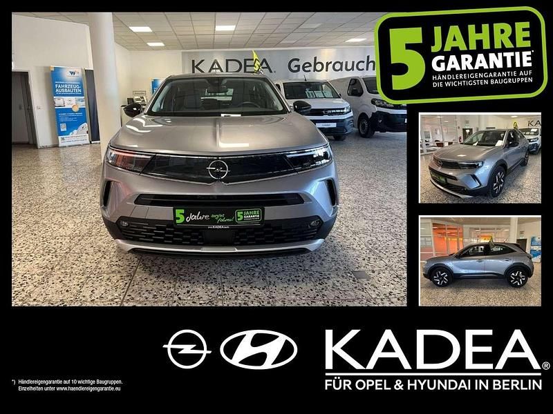 Gebraucht Opel Mokka Elegance 131 PS (96 kW) 2022 Kontrast grau/quarz silber SUV