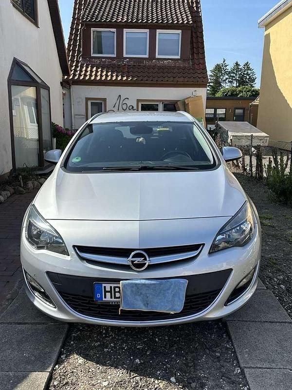 Grau Gebraucht 2015 Opel Astra Exklusiv Kombi | 5.499 € (Fairer Preis) - Bild 1/4