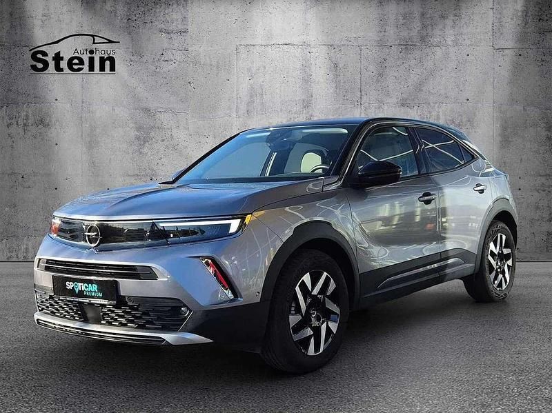 Gebraucht Opel Mokka-e Elegance 100 kW (136 PS) 2022 Kontrast grau/quarz silber (metallic) SUV