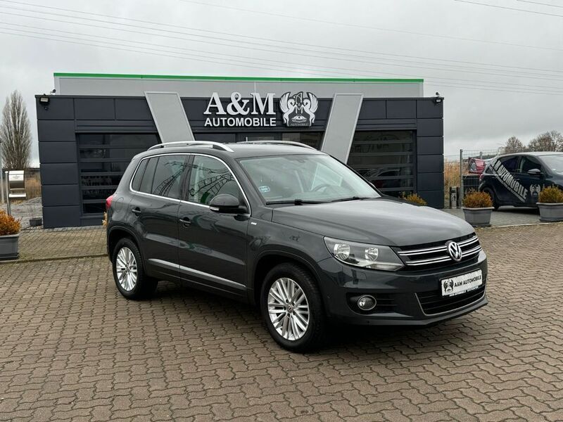Grau Gebraucht 2014 VW Tiguan Sportline SUV | 10.990 € (Fairer Preis) - Bild 1/4