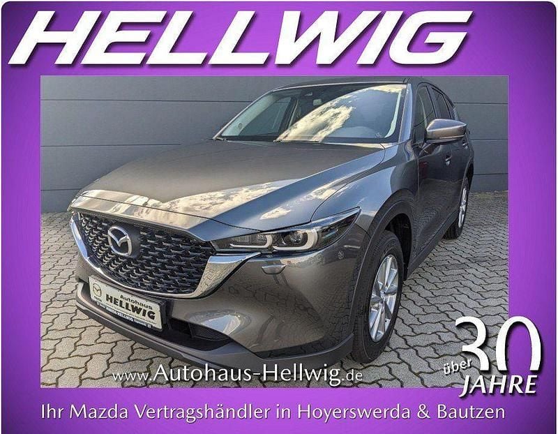 Machine grey metallic (metallic) Gebraucht 2024 Mazda CX-5 Center-Line SUV | 26.280 € (Superpreis) - Bild 1/4