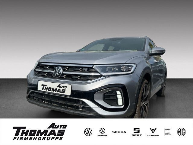 Pyritsilber metallic Gebraucht 2024 VW T-Roc R-line SUV | 29.985 € (Fairer Preis) - Bild 1/2