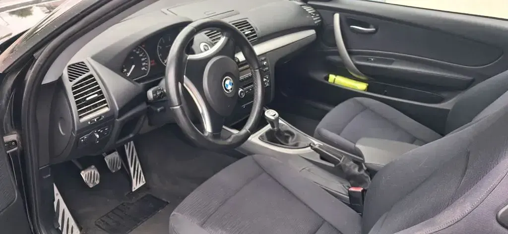 Gebraucht BMW 116 122 PS (89 kW) 2009 Schwarz Kleinwagen
