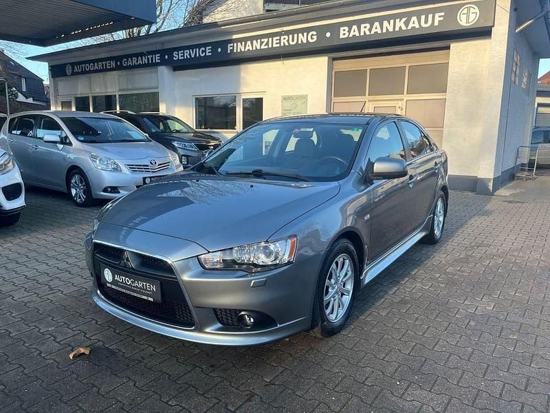 Grau Gebraucht 2013 Mitsubishi Lancer Limousine | 6.950 € (Fairer Preis) - Bild 1/4