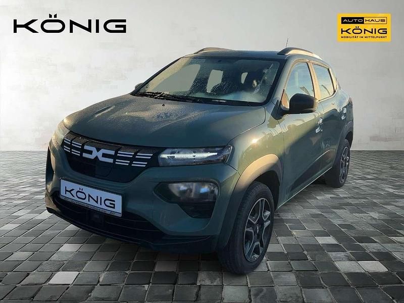 Grün "flechtengrau" Gebraucht 2023 Dacia Spring Essentiel Kleinwagen | 16.752 € (Teuer) - Bild 1/4