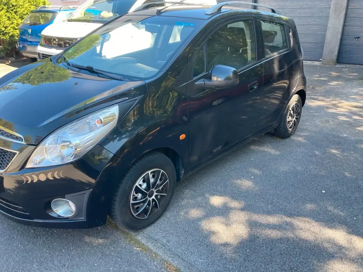 Gebraucht Chevrolet Spark 82 PS (60 kW) 2011 Schwarz Kleinwagen
