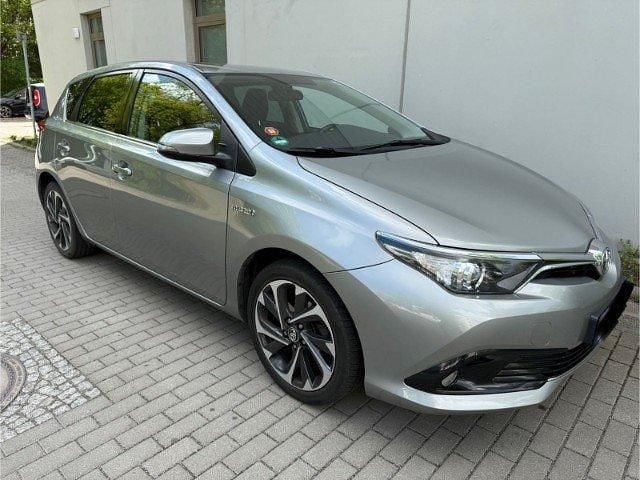 Grau metallic Gebraucht 2015 Toyota Auris Hybrid Design Limousine | 14.399 € (Teuer) - Bild 1/4