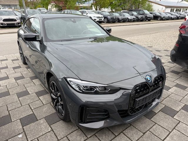 Grau Gebraucht 2022 BMW i4 Sport Line Limousine | 44.980 € (Superpreis) - Bild 1/4
