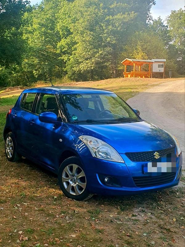 Blau Gebraucht 2013 Suzuki Swift Kleinwagen | 4.990 € (Fairer Preis) - Bild 1/4