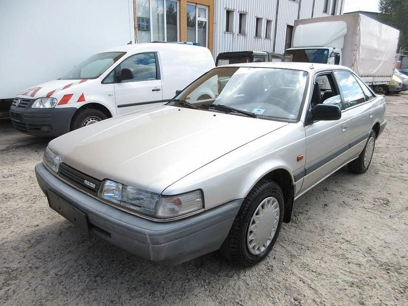 Grau Gebraucht 1990 Mazda 626 Limousine | 1.800 € - Bild 1/4