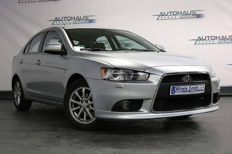 Coolsilber (m) Gebraucht 2012 Mitsubishi Lancer Kleinwagen | 6.990 € (Fairer Preis) - Bild 1/4