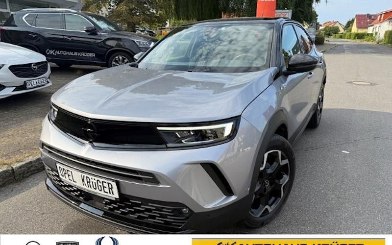 Gebraucht Opel Mokka Ultimate 131 PS (96 kW) 2023 Kontrast grau/quarz silber (metallic) SUV