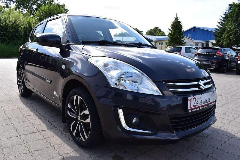 Grau Gebraucht 2015 Suzuki Swift X-TRA Limousine | 7.990 € (Fairer Preis) - Bild 1/4