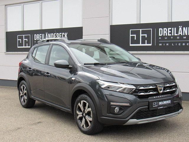Grau Gebraucht 2023 Dacia Sandero Comfort Kleinwagen | 14.990 € (Fairer Preis) - Bild 1/4