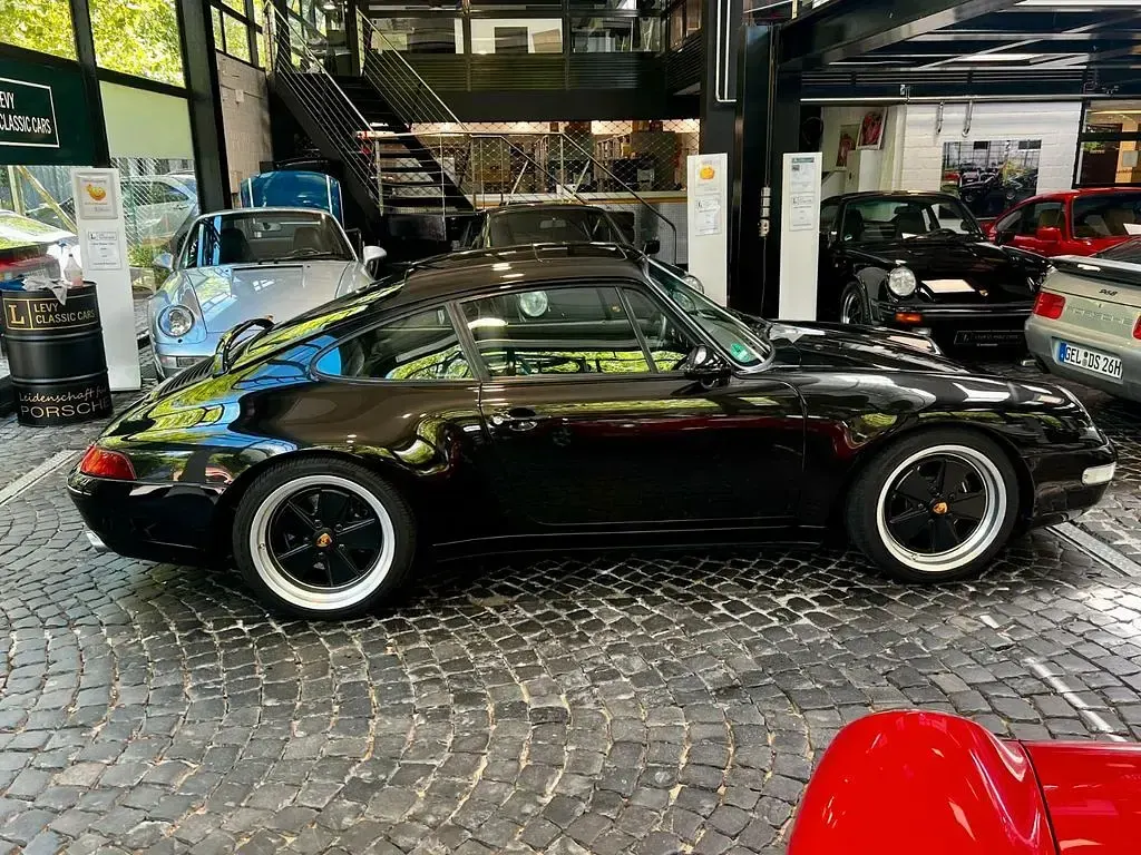 Gebraucht Porsche 911 Carrera 272 PS (200 kW) 1995 Schwarzmetallic Coupé