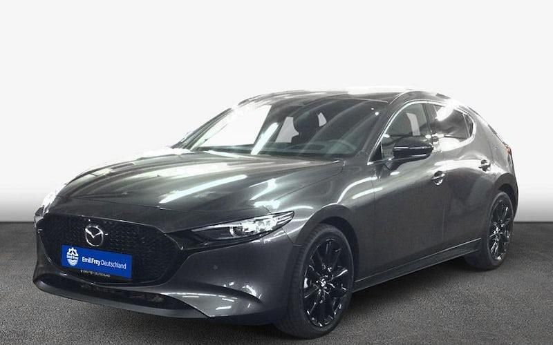 Machine grey metallic Gebraucht 2024 Mazda 3 Homura-Line Limousine | 27.901 € (Fairer Preis) - Bild 1/4