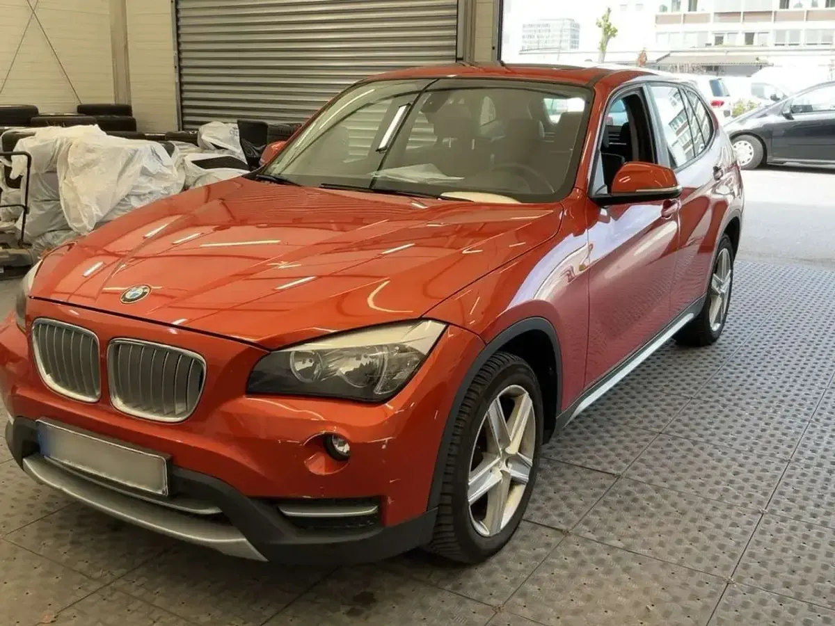 Second-hand BMW X1 143 CP (105 kW) 2013 Portocaliu SUV