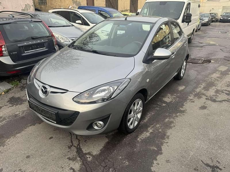 Plutossilber metallic Gebraucht 2012 Mazda 2 Edition Kleinwagen | 5.499 € (Fairer Preis) - Bild 1/4