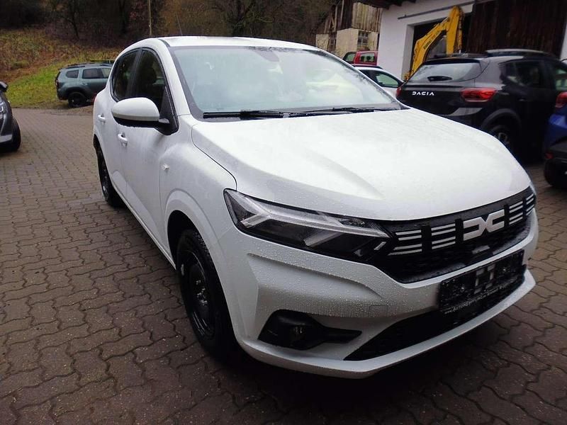 Arktisweiss und andere Neu 2025 Dacia Sandero Essentiel Limousine | 15.499 € - Bild 1/4