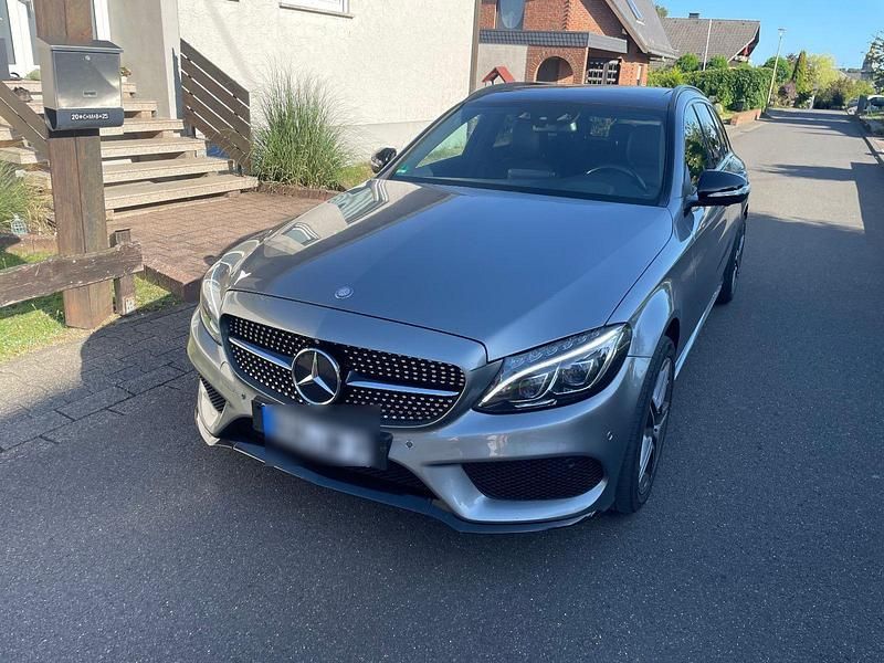 Grau Gebraucht 2015 Mercedes C250 AMG line Kombi | 20.450 € (Guter Preis) - Bild 1/4