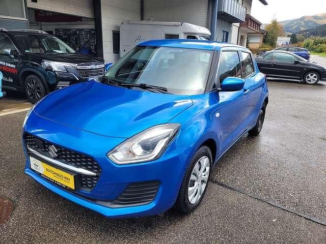 Speedy blue met. Gebraucht 2023 Suzuki Swift Basic Kleinwagen | 13.990 € - Bild 1/4