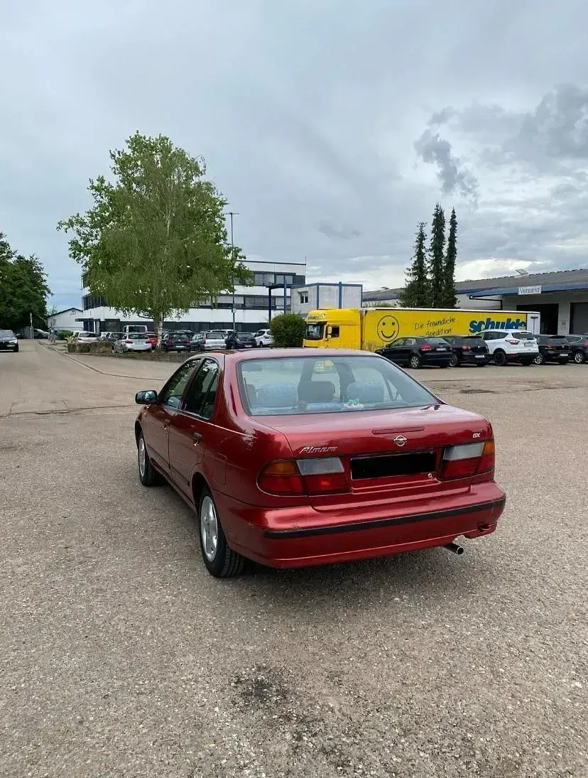 Gebraucht Nissan Almera 75 PS (55 kW) 1997 Rot Kleinwagen