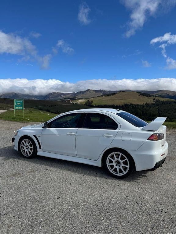 Weiß Gebraucht 2014 Mitsubishi Lancer Limousine | 25.490 € (Fairer Preis) - Bild 1/4