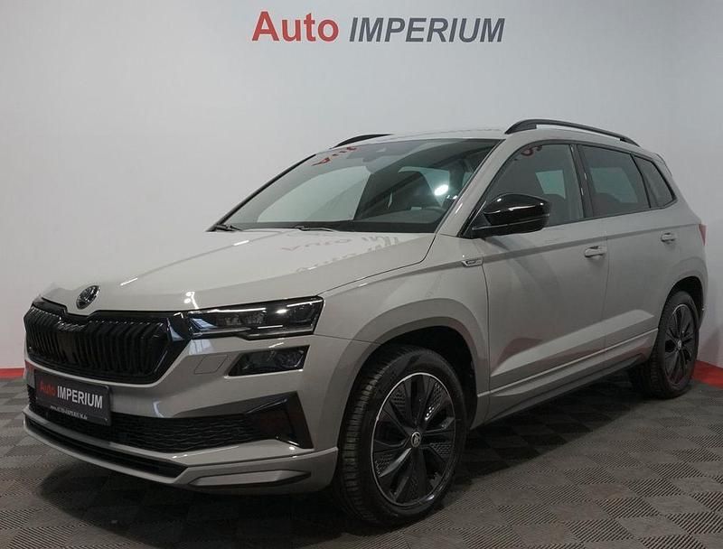 Grau Gebraucht 2022 Skoda Karoq SportLine SUV | 31.590 € (Fairer Preis) - Bild 1/4