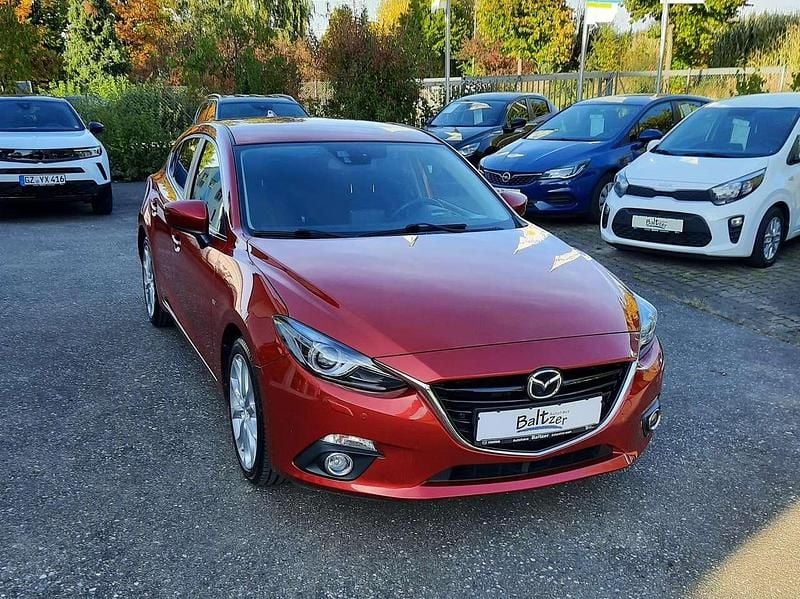 Rubinrotmetallic (metallic) Gebraucht 2015 Mazda 3 Sports-Line Limousine | 12.990 € (Fairer Preis) - Bild 1/4