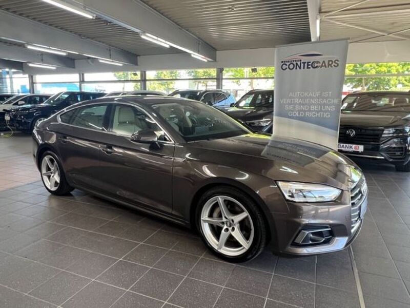 Argusbraun (metallic) Gebraucht 2019 Audi A5 Sport Coupé | 28.999 € (Fairer Preis) - Bild 1/4
