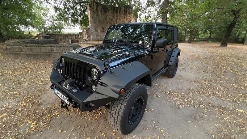 Schwarz Gebraucht 2018 Jeep Wrangler Unlimited Sahara SUV | 33.999 € (Fairer Preis) - Bild 1/4