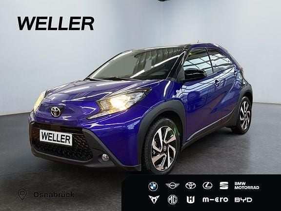 Blau Gebraucht 2024 Toyota Aygo X Team SUV | 15.330 € (Guter Preis) - Bild 1/3