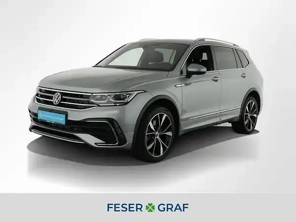 Pyritsilber metallic Gebraucht 2024 VW Tiguan Allspace SUV | 43.907 € (Guter Preis) - Bild 1/4