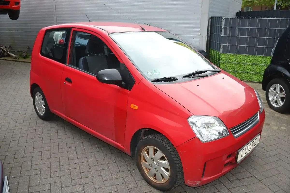 Gebraucht Daihatsu Cuore 58 PS (42 kW) 2005 Rot Kleinwagen