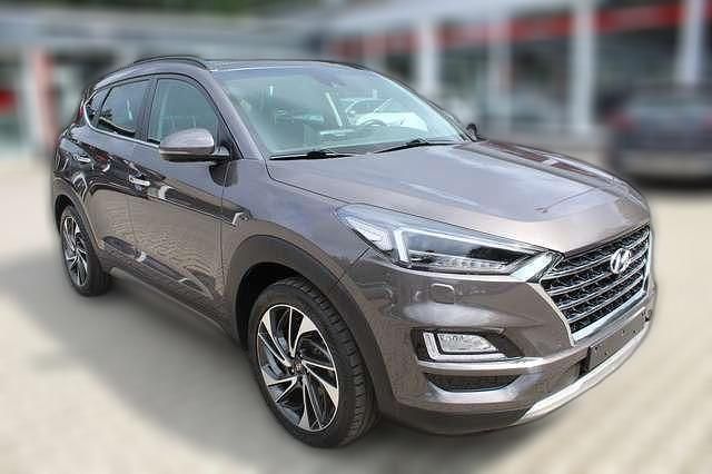 Braun metallic Gebraucht 2019 Hyundai Tucson Premium SUV | 23.650 € (Teuer) - Bild 1/4