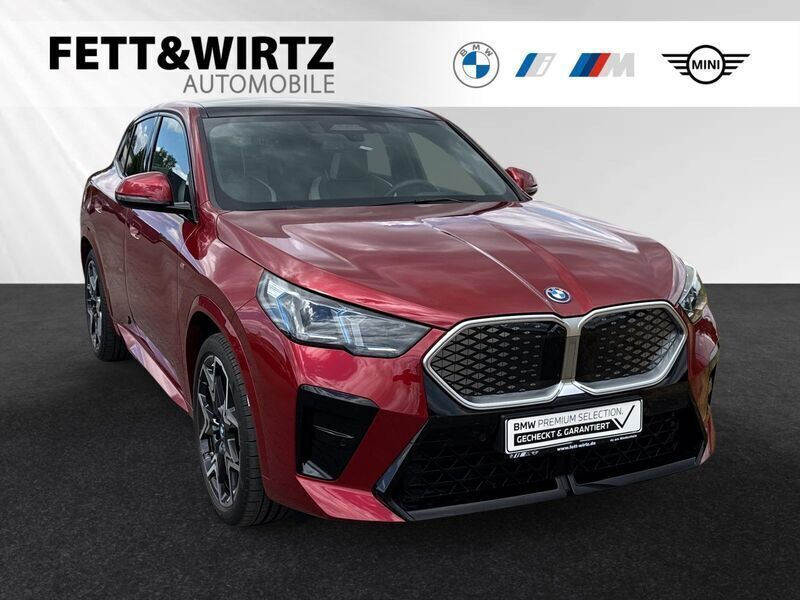 Fire red metallic Gebraucht 2023 BMW iX2 M Sport SUV | 45.700 € (Superpreis) - Bild 1/3