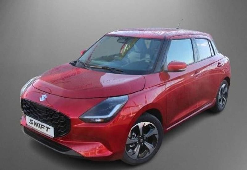 Burning red pearl Neu 2025 Suzuki Swift Comfort+ Kleinwagen | 22.790 € - Bild 1/4