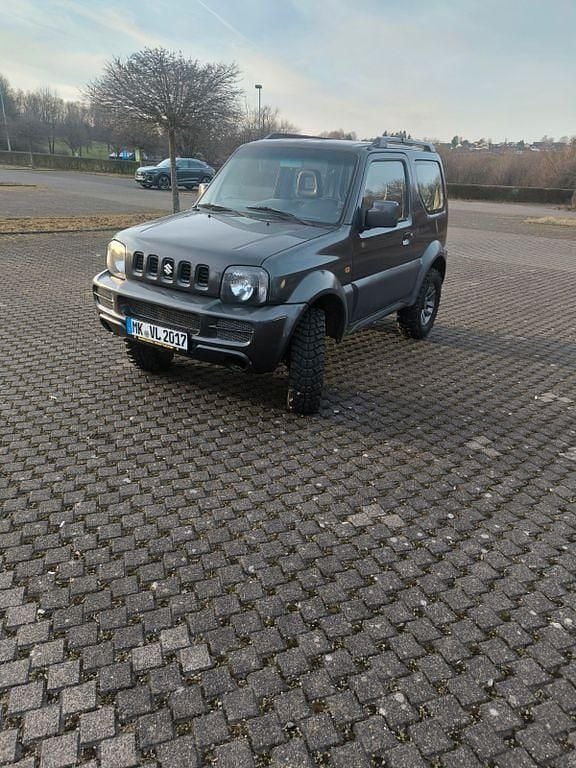 Grau Gebraucht 2012 Suzuki Jimny SUV | 8.850 € (Fairer Preis) - Bild 1/4