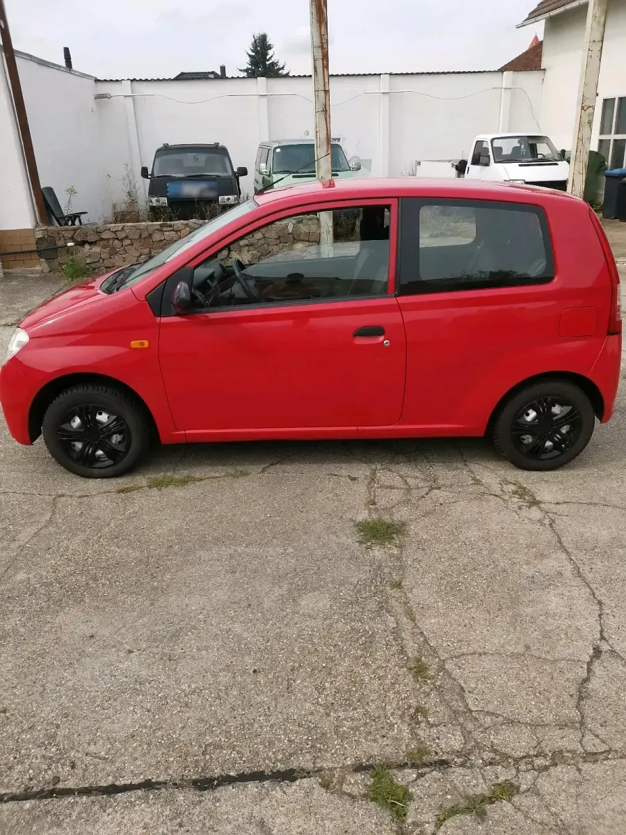 Gebraucht Daihatsu Cuore 58 PS (42 kW) 2004 Rot Kleinwagen