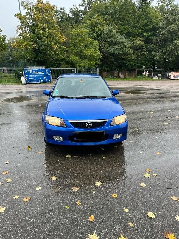 Blau Gebraucht 2003 Mazda 323F Kleinwagen | 1.999 € (Fairer Preis) - Bild 1/4