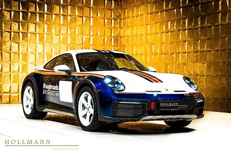 White/gentian blue metallic Neu 2025 Porsche 992 Coupé | 355.572 € - Bild 1/4