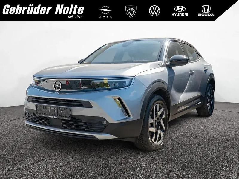 Quarz grau Gebraucht 2022 Opel Mokka-e Elegance SUV | 19.950 € (Fairer Preis) - Bild 1/3