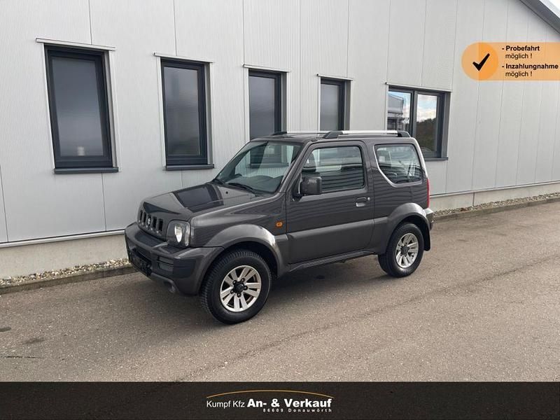 Grau Gebraucht 2012 Suzuki Jimny Style SUV | 8.980 € (Superpreis) - Bild 1/4