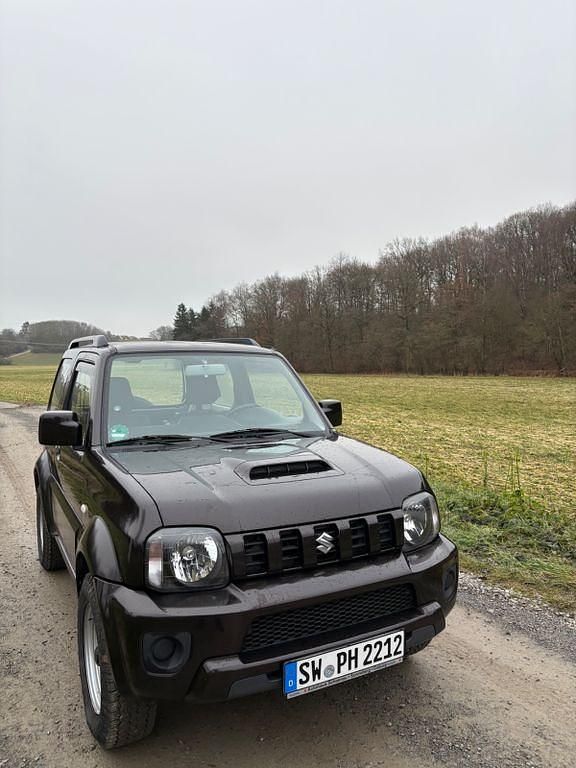 Braun Gebraucht 2015 Suzuki Jimny Comfort SUV | 12.700 € (Fairer Preis) - Bild 1/4