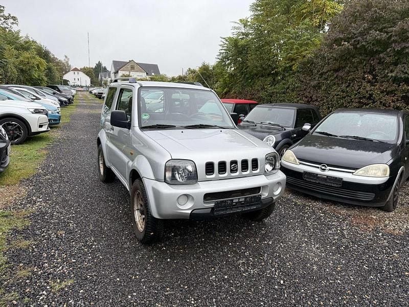 Grau Gebraucht 2002 Suzuki Jimny SUV | 4.599 € (Superpreis) - Bild 1/4
