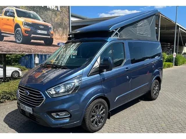 Chromablau metallic Neu 2025 Ford Tourneo Custom Limited Limousine | 62.990 € - Bild 1/4