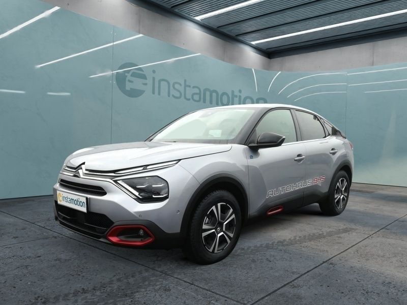 Grau Gebraucht 2022 Citroën e-C4 Shine Limousine | 25.490 € (Teuer) - Bild 1/4